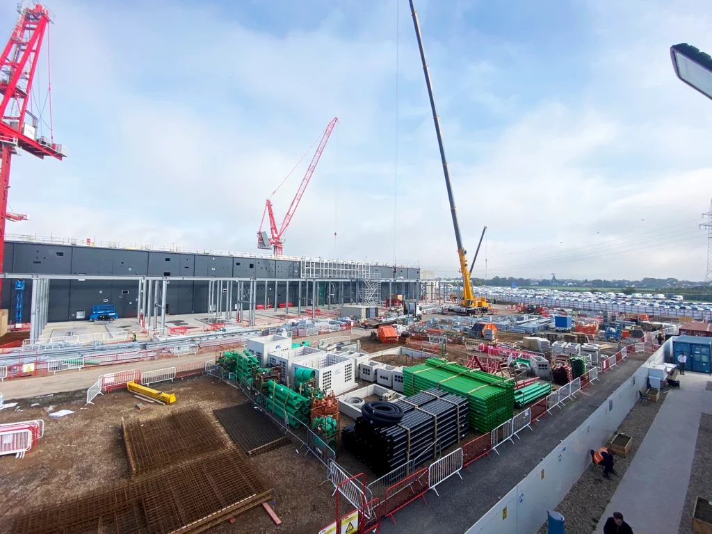 Industrial site build featuring cranes and materials ready for use in the build. DDG Group groundworks.